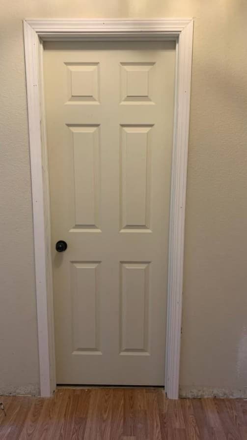 Interior bedroom door replacement with clean white finish